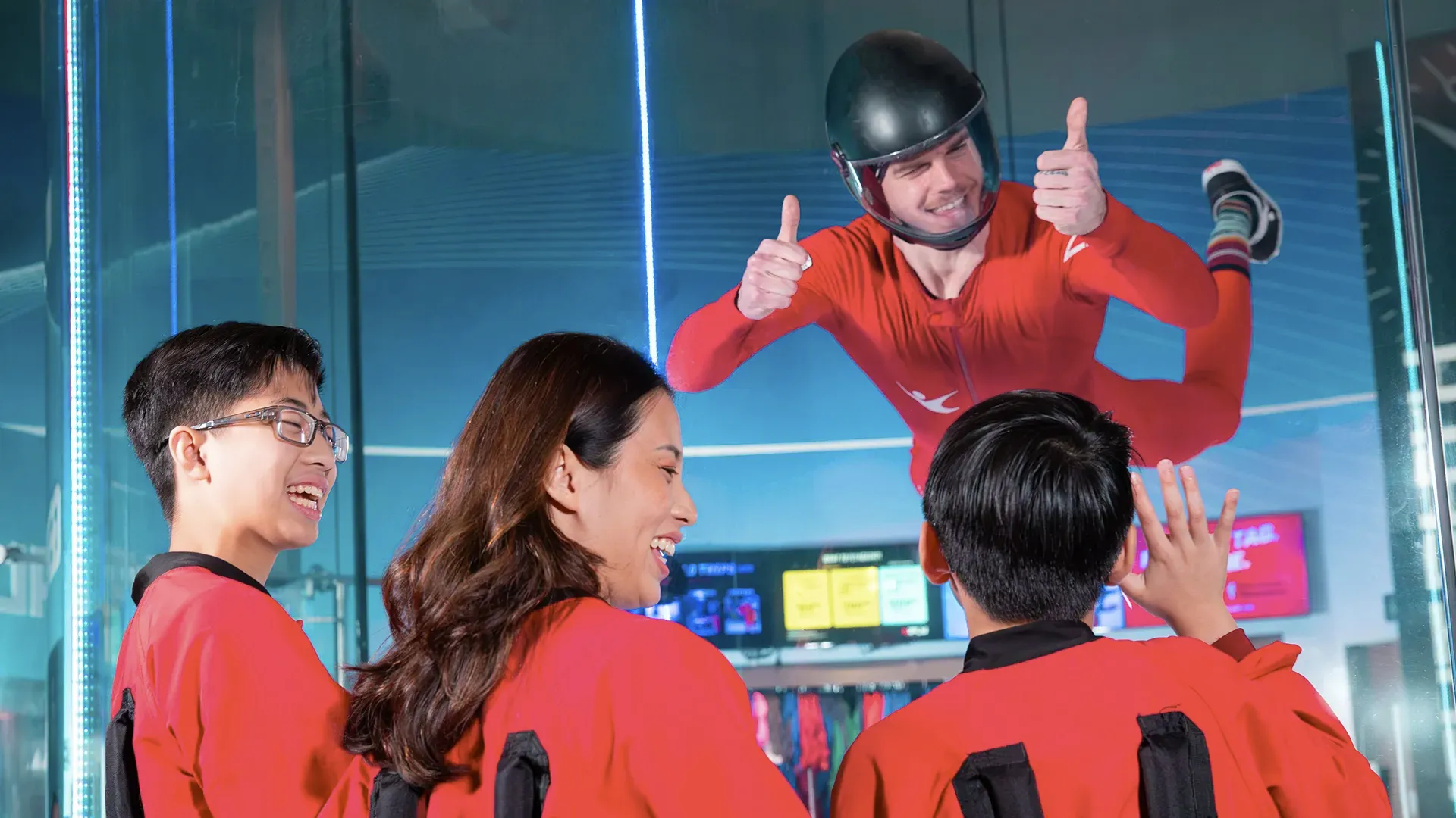 Family enjoying an indoor skydiving experience at iFLY during a fall outing